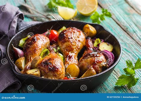 Roasted Chicken Legs with Vegetables Stock Photo - Image of black ...
