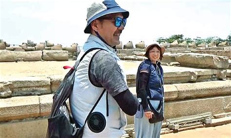 Pretty cool! Japanese couple in AC jackets turn head-turner at hot Mahabs