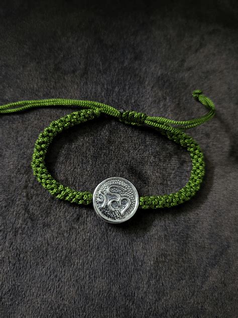 Sterling silver Om rakhi in adjustable thread – Odara Jewellery