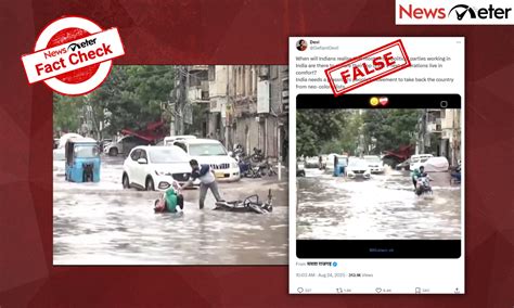 Fact Check: Flooded roads in India – Woman with child falls off bike ...