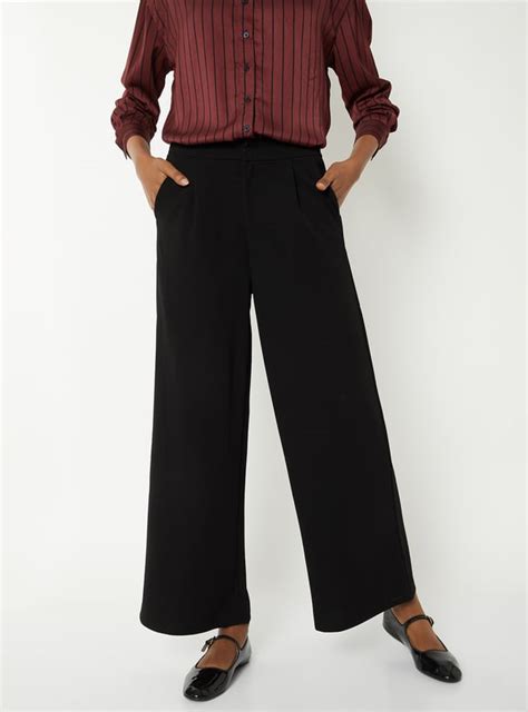 Buy Women Solid Wide Leg Trousers Online at just Rs. 999.0 ...