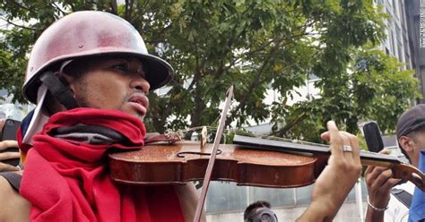 Man 'Protests' By Playing Violin In The Middle Of A Crowd, Police Hand ...