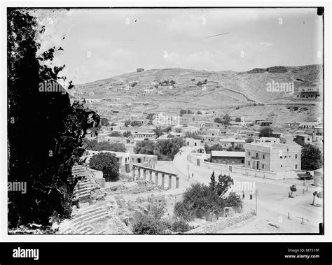 This image showcases Amman, the capital city of Jordan, highlighting its urban landscape and ...
