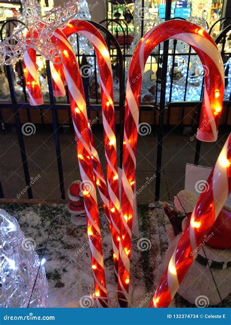 Glowing Light Candy Canes in a Snowy Christmas Scene Stock Photo ...