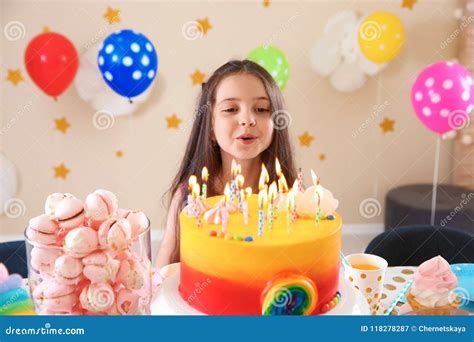 Cute Little Girl Blowing Out Candles on Her Birthday Cake Stock Image ...