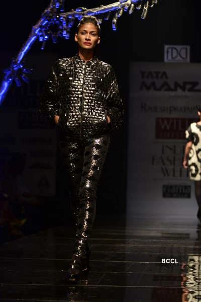 A model showcases a creation by designer Rajesh Pratap Singh on Day 2 ...