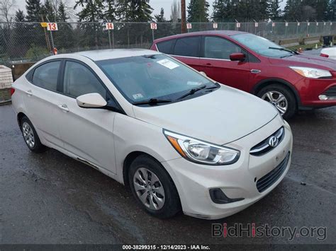 Report KMHCT4AE2FU903284 HYUNDAI ACCENT 2015 Tan Gasoline - price and damage history