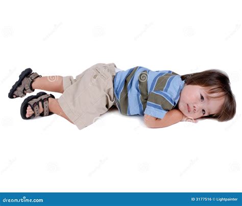 Child Laying On Ground Outside Stock Image | CartoonDealer.com #42911071