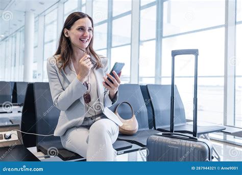 Businesswoman Doing a Calls while at Gate of Airport Stock Image ...