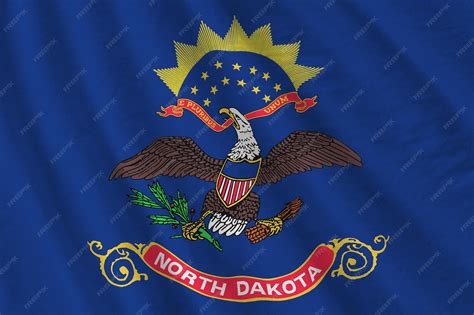 Premium Photo | North dakota us state flag with big folds waving close ...