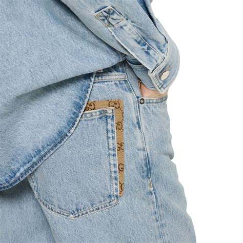 Pantalone in denim délavé con inserto GG in celeste | GUCCI® Italia