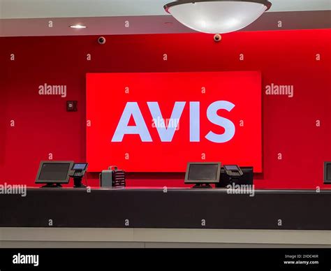 Avis car rental counter at an Airport Stock Photo - Alamy