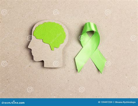 World Mental Health Day Concept. Green Awareness Ribbon and Brain ...