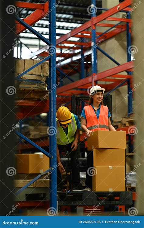 Warehouse Workers Working in the Retail Warehouse Full of Shelves with Goods. Manufacture ...