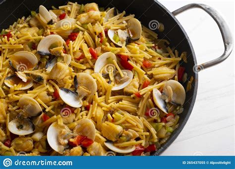 Fish Fideua. Noodles with Monkfish and Clams. Recipe for Cooking in ...