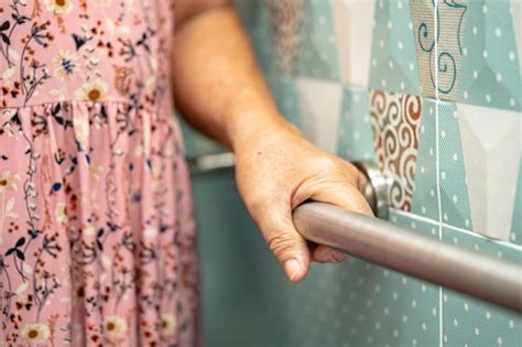 Asian elderly woman patient use toilet bathroom handle security in ...