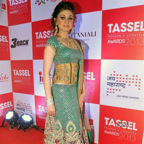 Lovely models walk the ramp in vibrant orange attires during Tassel ...