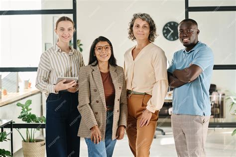 Premium Photo | Group of successful intercultural white collar workers in smart casualwear