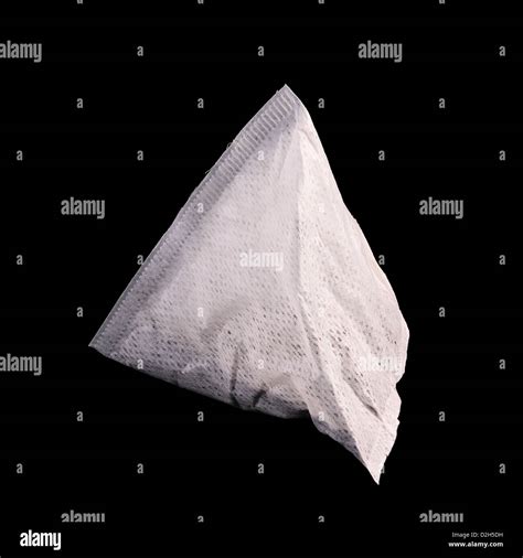 PG Tips pyramid tea bag isolated on black background Stock Photo - Alamy