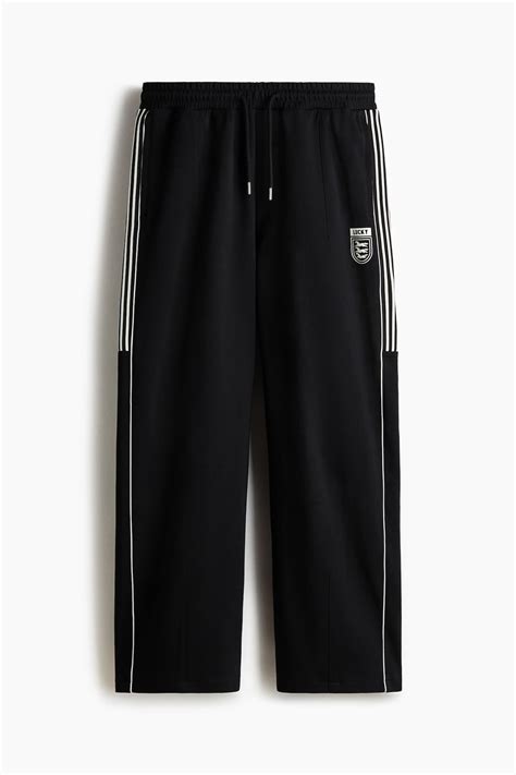 Men’s Black/Lucky Loose Fit Joggers | H&M IN