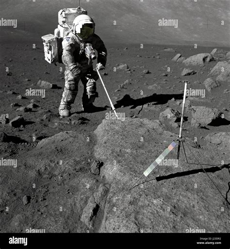 NASA Apollo 17 lunar mission astronaut Harrison Schmitt retrieves ...