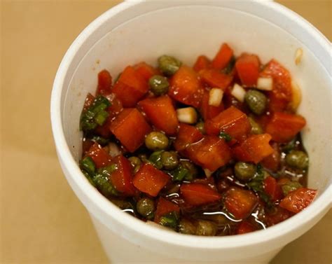 Close-up on salmon fillet with fruit salsa, over rice.