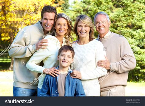 Happy Family In Park. Grandfather, Grandmother, Father, Mother And Son ...