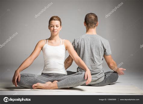 Couple sitting in lotus position Stock Photo by ©OlgaZakrevskaya 135665690