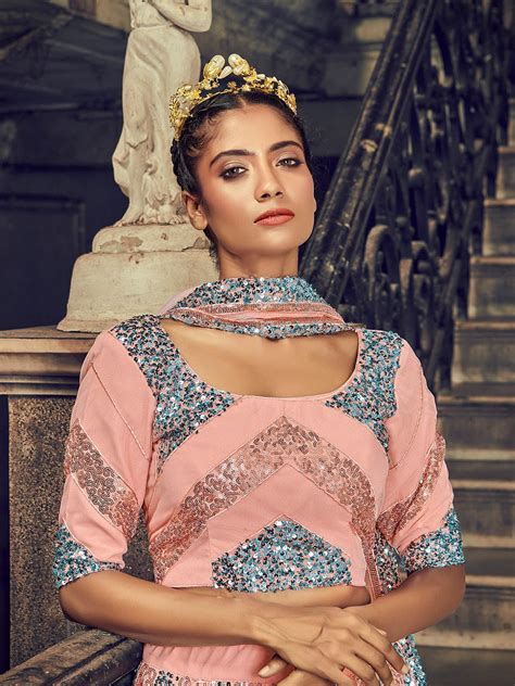 Buy Impressive Peach Net Sequins Lehenga Set Online. – Odette