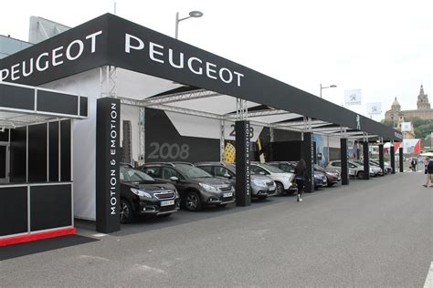 Peugeot and Renault outdoor boxes at the last year\'s Barcelona Motor Show