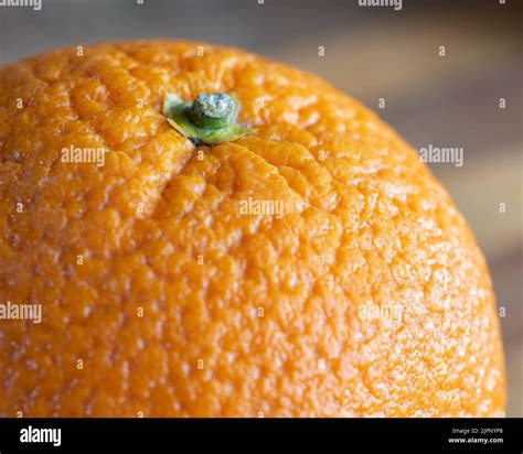 Orange in close-up. Structure of an orange peel on a macro scale. Juicy ...