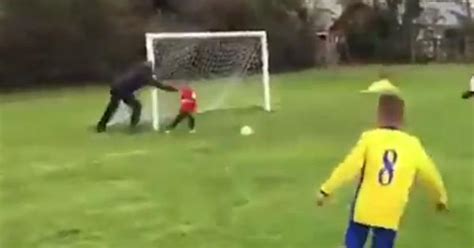 A video of a man pushing his goalkeeper son to stop a football has gone ...