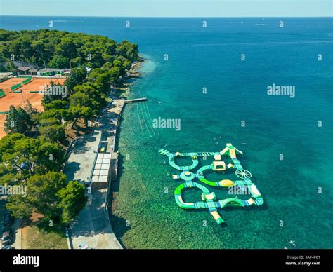 Aerial view of Tennis courts and a water playground for kids along the ...