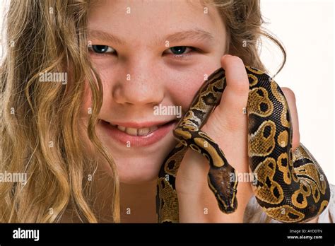 Young girl with her pet python snake Stock Photo - Alamy