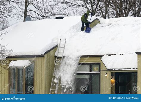 Clearing Snow from a Roof in Quebec Editorial Photography - Image of ...