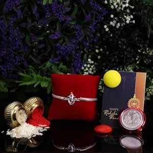 Oblivion Pooja Thali with Rakhi – Silver Color Lord Ganesh Ji with Red ...