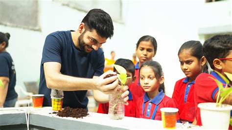 Amazonian planting a plant, as a part of save trees save lives campaign ...