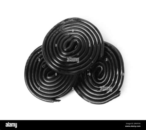 Tasty black liquorice candies on white background, top view Stock Photo ...