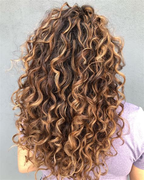 Curly Light Brown Hair With Blonde Highlights