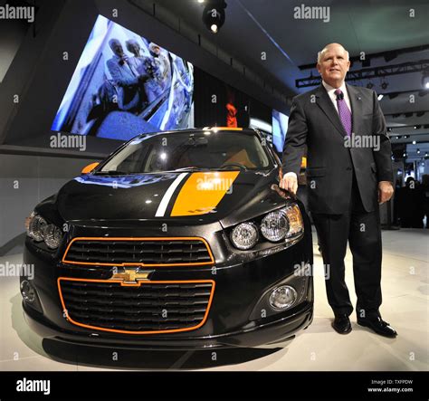 Dan Akerson, chairman and CEO of General Motors, poses with the 2011 Chevrolet SOnic Z-spec ...