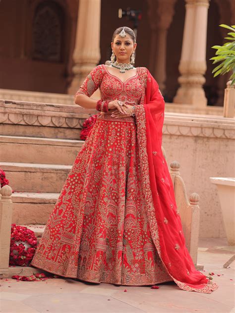 Rich Coral Red Heavy Gold Motif Lehenga – Suvidha Fashion