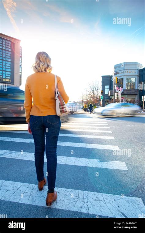 USA Maryland Bethesda Pedestrian safety woman crossing in a crosswalk ...