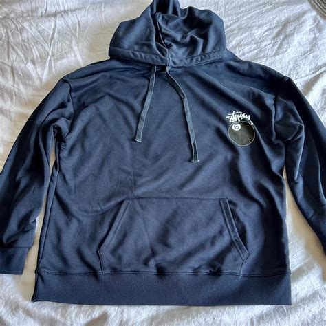 Stüssy navy blue hoodie with a 8 ball design on the... - Depop