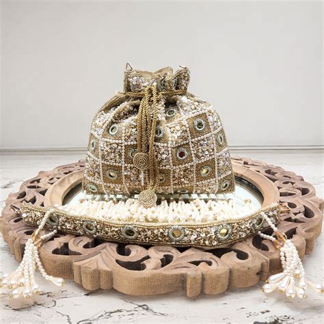 Rajwada Sheesh Gold Potli – BAGZAPPERR