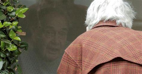 88-YO Woman Talking To Quarantined Husband Through Window