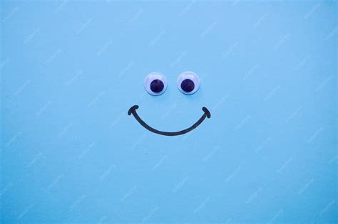 Smile emotion on the blue background | Premium Photo