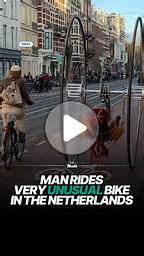Cyclist rides very unusual bike in the Netherlands