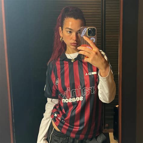 Dua Lipa says her spring uniform is a layered soccer tee—see photos ...