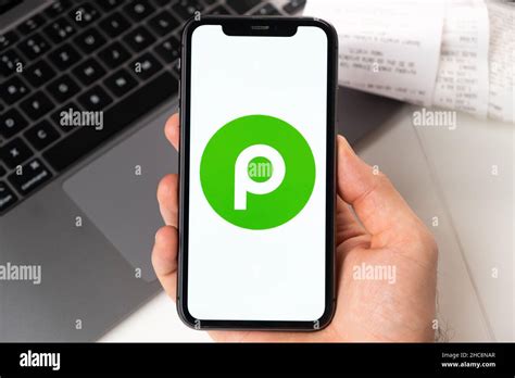 Publix application on the screen of Apple iPhone in mans hand and ...
