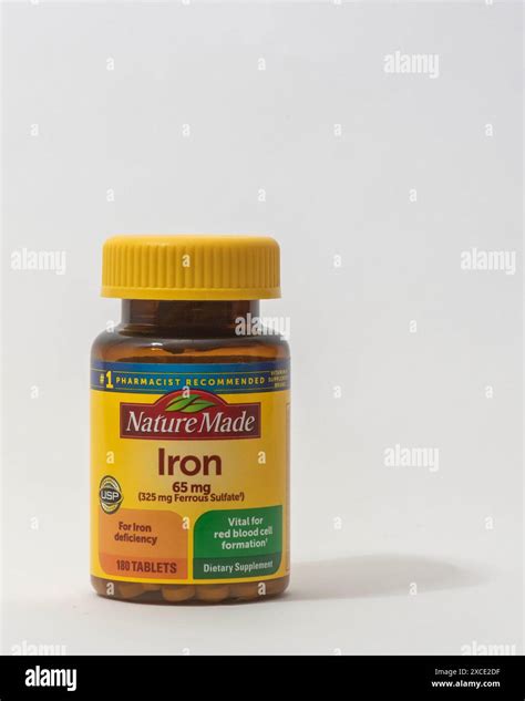 Davis, CA, 11 May, 2024. Bottle of Nature Made Iron supplement on white ...